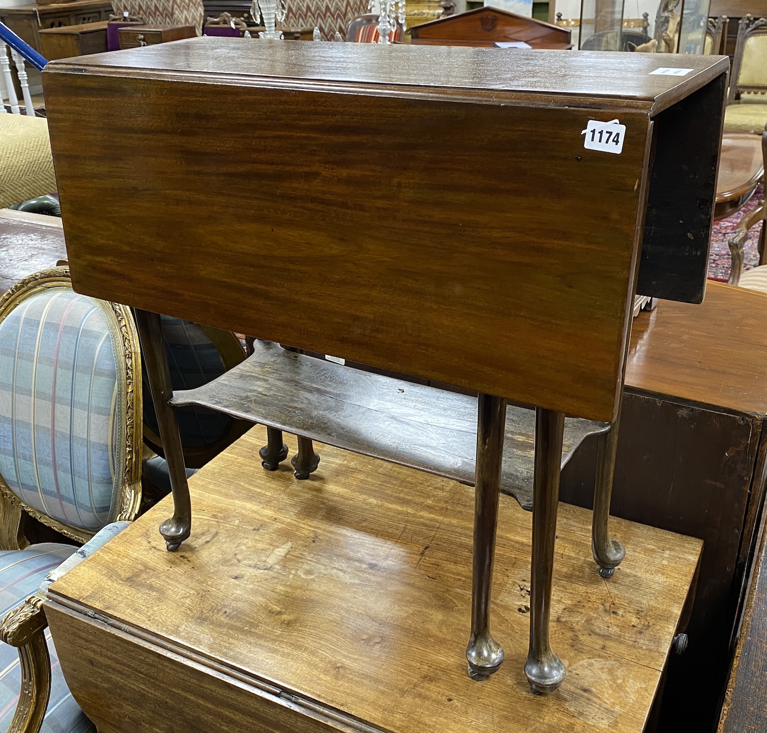 A George III mahogany pad foot drop leaf two tier tea table, width 71cm, depth 82cm extended, height 69cm